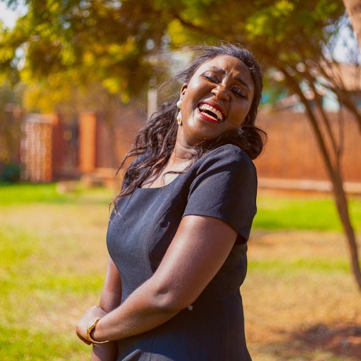 Ava Lin, Lead Design Curator at Holistic Lifestyle Path, reviewing corporate floral arrangements